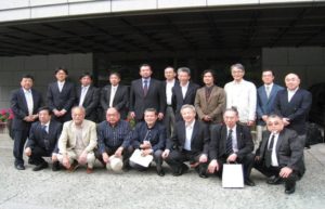 A group of men in suits and ties posing for a picture.