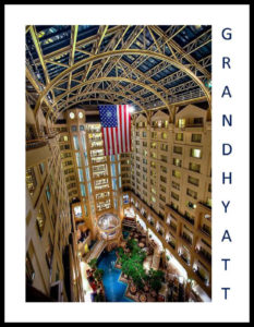 A large atrium with a pool in the middle of it.