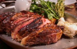 A close up of steak on a plate